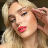 Suzy Lipsticks Suzy x SJ satin lipstick in a sleek tube, featuring a smooth, creamy finish and soft pink shade.